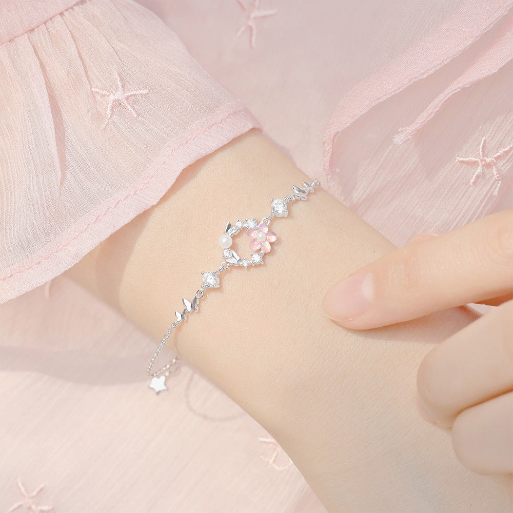 Delicate Pearl and Cubic Zirconia Flower Butterfly Charm Bracelet in Sterling Silver