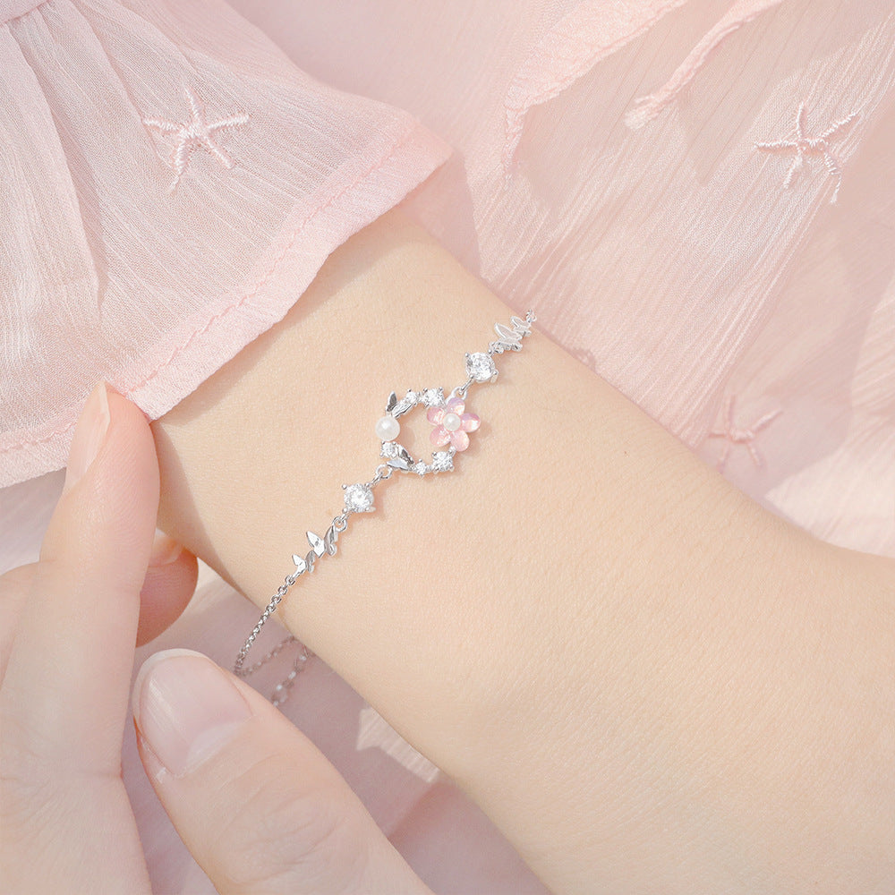 Delicate Pearl and Cubic Zirconia Flower Butterfly Charm Bracelet in Sterling Silver