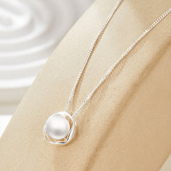 Unveiling the Story: Geometric Pearl Necklace with a Hidden Narrative