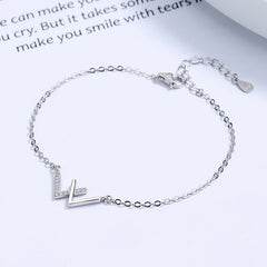 Captivating Curves: Sterling Silver W Initial Bracelet