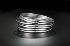 Stackable Elegance: Stainless Steel Bangle Bracelet Set (7 Bangles)